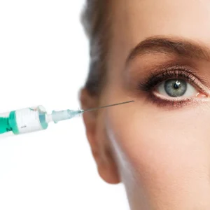 people, cosmetology, plastic surgery and beauty concept - beautiful young woman face and beautician hand in glove with syringe making injection over white background